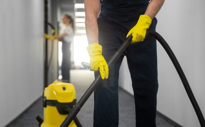 front-view-man-cleaning-indoors_23-2150454545